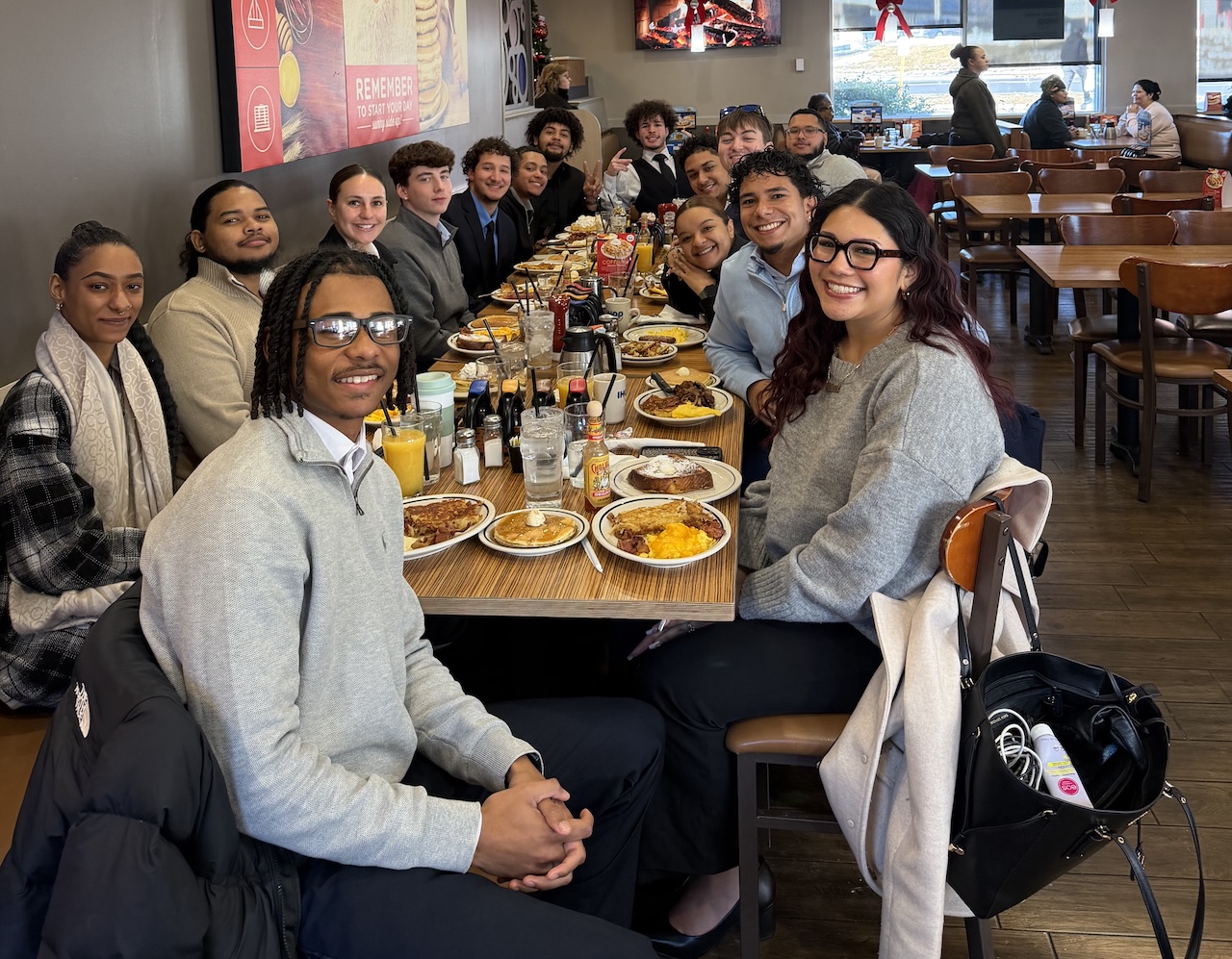 Skyline Consulting professional in a blue plaid suit