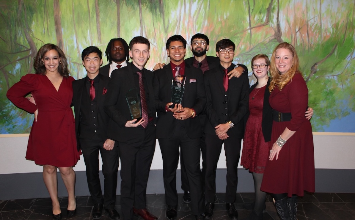 Skyline Consulting team members standing in a professional hallway