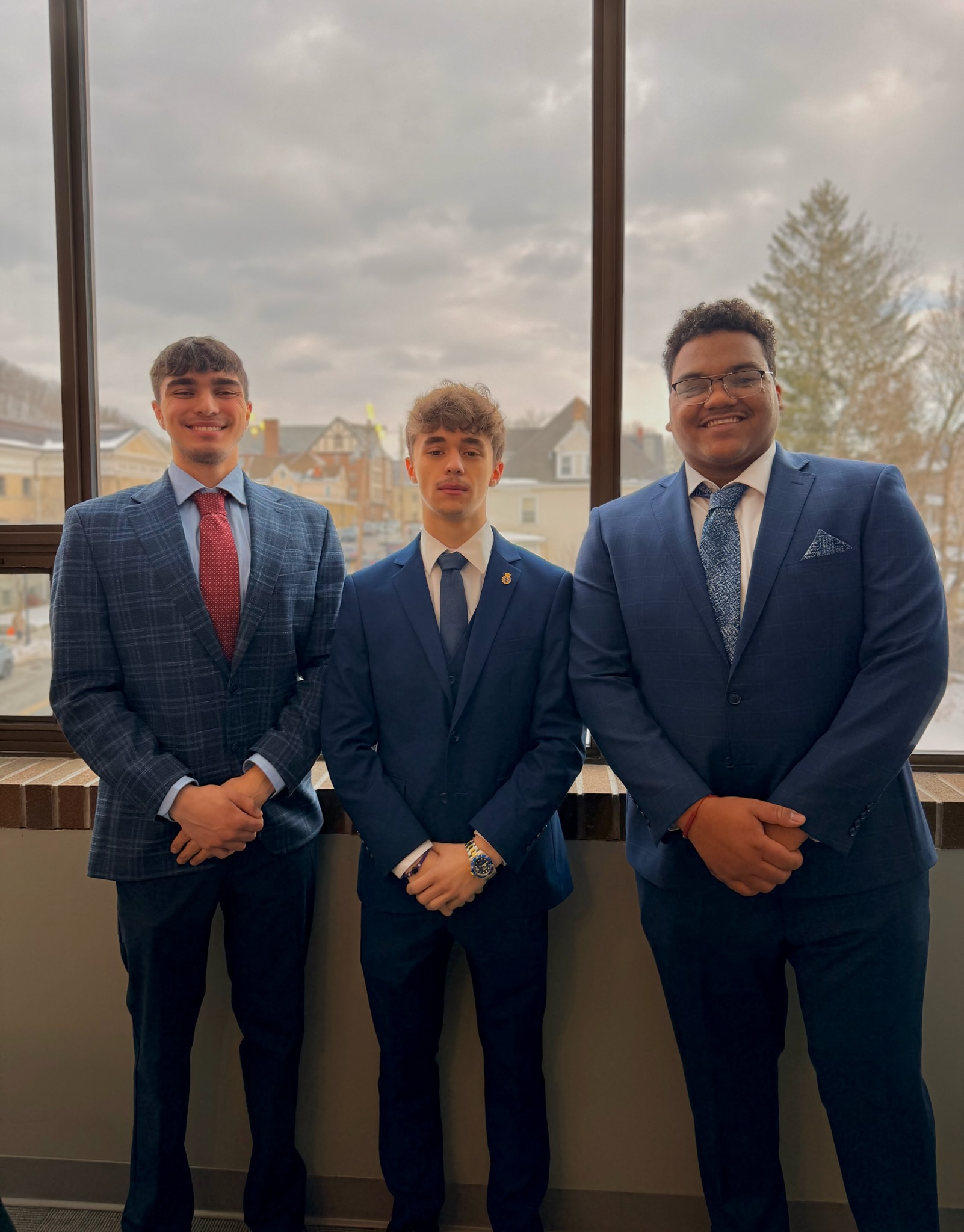 Three Skyline Consulting professionals in business attire
