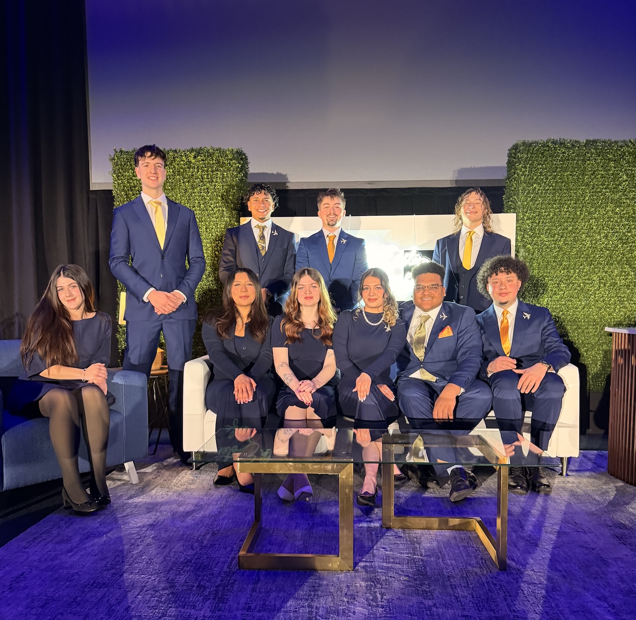 Skyline Consulting team group photo in New York City with holiday lights