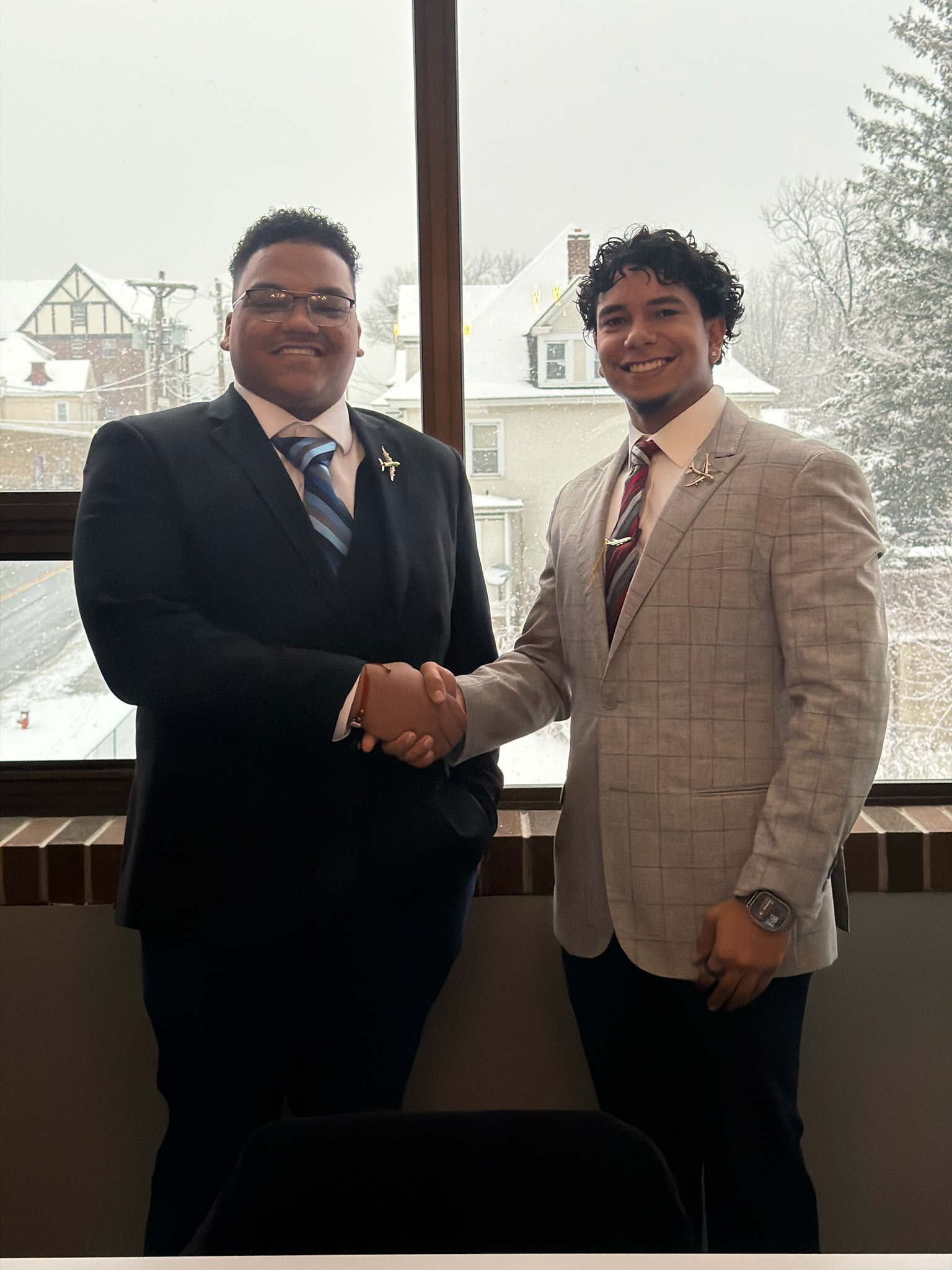 Skyline team members shaking hands in a professional setting